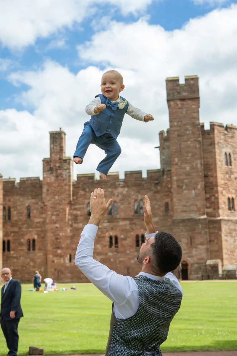 A playful moment in front of the castle